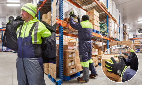 Worker wearing insulated freezer jacket & overalls in a cold storage unit