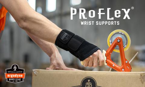 Worker wearing a ProFlex wrist brace support while taping a box