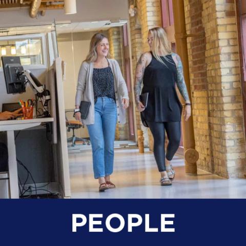 People (Two Ergodyne employees walking through the Ergodyne office)