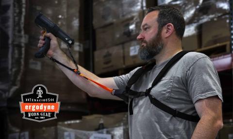 Worker wearing Squids barcode scanner harness and lanyard in a warehouse