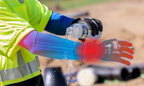 Worker pouring water on Ergodyne cooling sleeves. Red dots along the wrist and finger tips to indicate pulse points