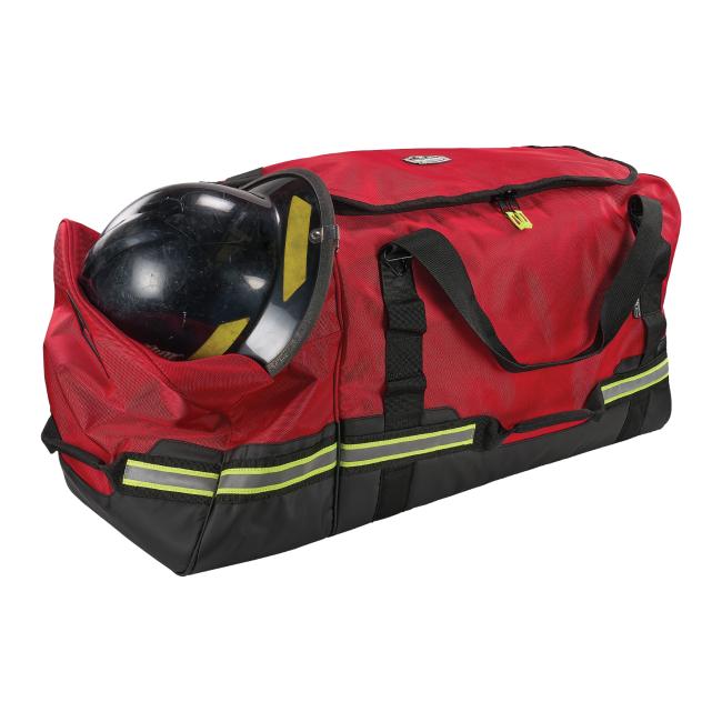 Propped red firefighter turnout bag with helmet