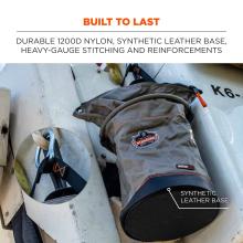 Built to last: durable 1200D nylon, synthetic leather base, heavy-gauge stitching and reinforcements. Arrow points to synthetic leather base