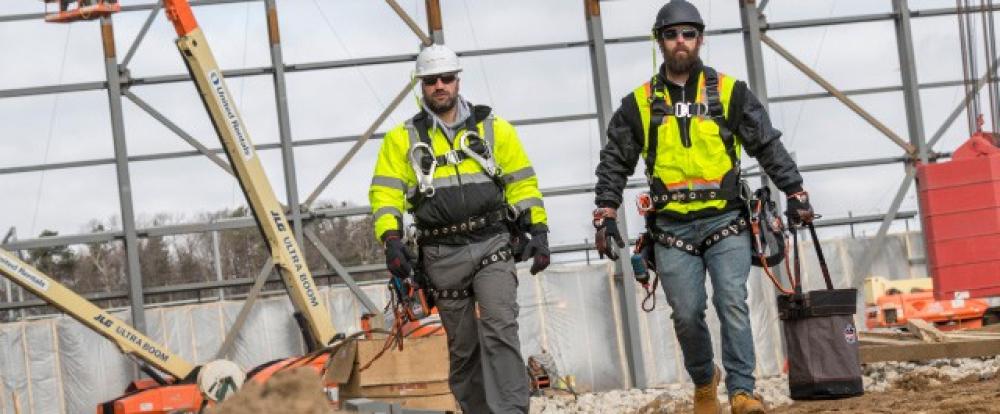 Side by side workers in hi vis gear