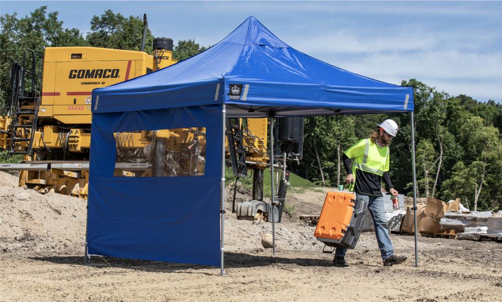 Worker under tent