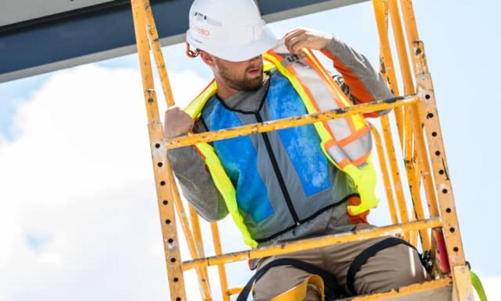 Blue cooling vest under hi-vis vest