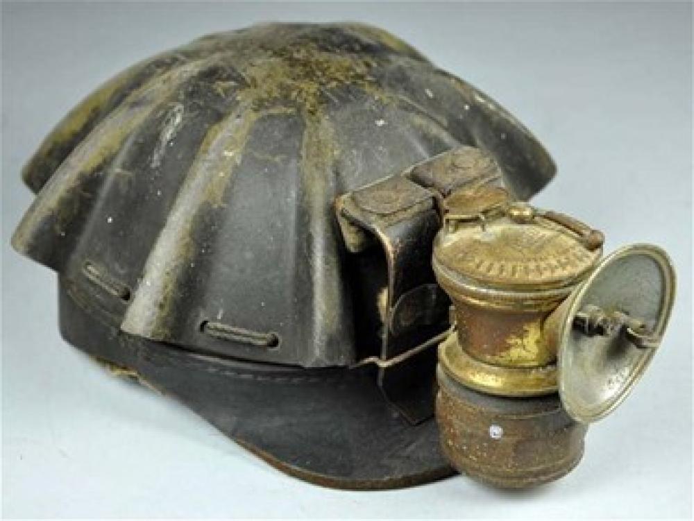 Old, broken hard hat headlamp