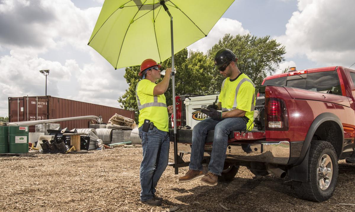 Workers taking a break beneath a tent