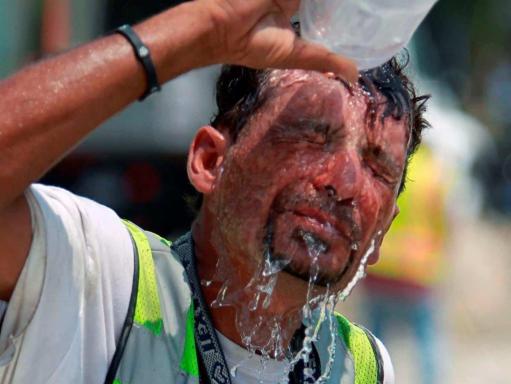 Cooling off with water on face